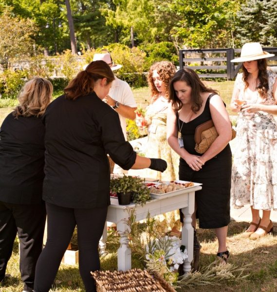 caterers serving guest at weddin