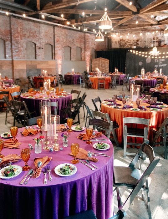 orange and purple wedding reception decor